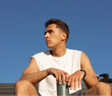 Male lifter holding a BOLDE Bottle