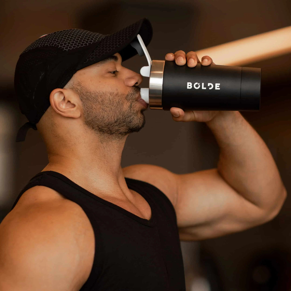Lifters holding BOLDE Bottles after training