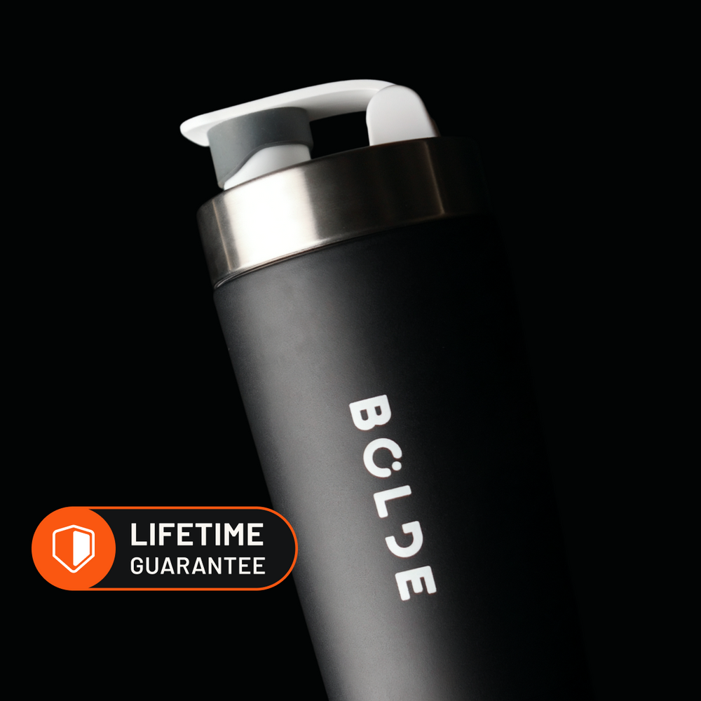 Two lifters holding BOLDE Bottles in a gym